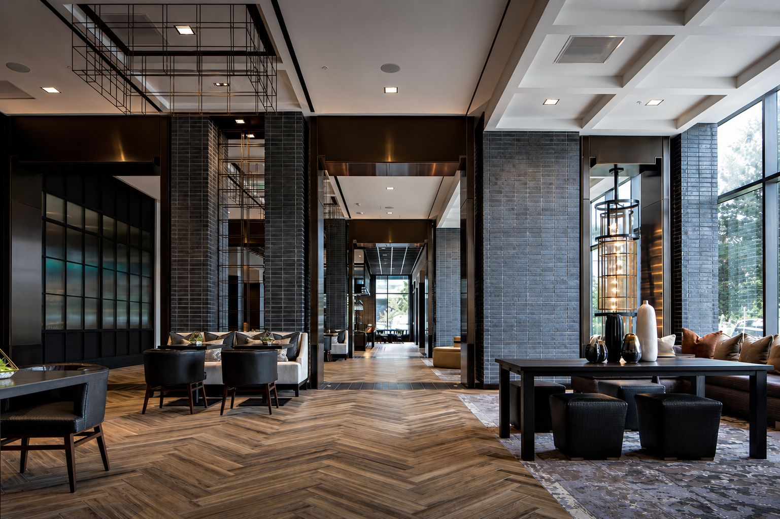 The lobby of the Houston CityPlace Marriott with herringbone floors and lantern lighting